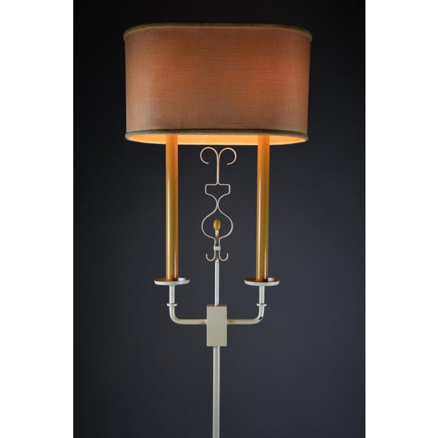 This striking two-arm floor lamp was designed and manufactured by stilnovo in milan, one of the defining names of italian...