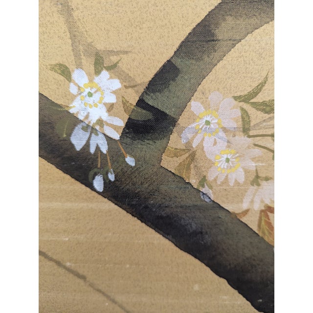 Four panel Japanese silk screen featuring a branch with cherry blossoms. Four individual mounted panels with wood frame...