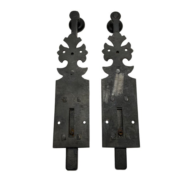A vintage pair of black metal sliding bolt gate latches in a dark black-bronze finish. They were brought back from a...