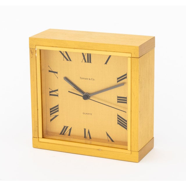 Group of Four Tiffany &amp; Co. Brass Desk Clocks, comprising: pair of circular with roman numeral rim and gilt metal...