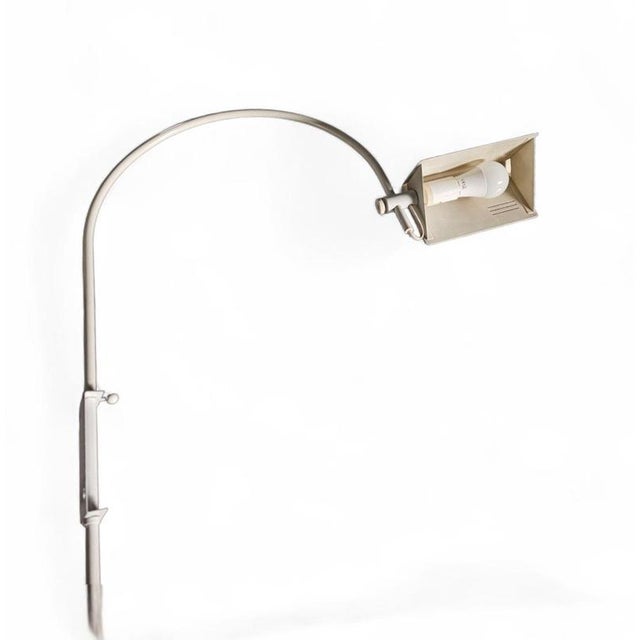 Rare vintage adjustable white wall arch lamp from the 70s. Rare vintage white wall arch lamp from the 70s.The hood can be...