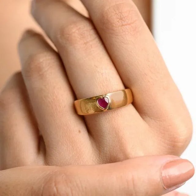 This is part of Chairish’s Fine Jewelry assortment. Dainty Heart Cut Ruby Pinky Ring Signet Ring in 18K Gold featuring...
