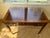 Solid wood writing desk with three drawers (clean and slide easily) featuring brass hardware. Tapered legs with brass...