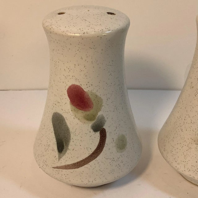 A lovely stoneware pattern from Noritake. This vintage discontinued set of salt and pepper shaker is the County Fair...