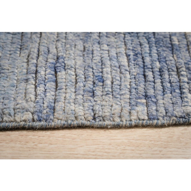 Hand-knotted in premium wool, this 12 x 15 Marrakech Ocean Blue rug carpet is a refined addition to our contemporary...