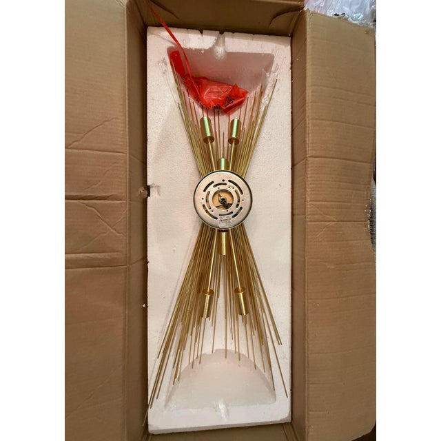 One single sconce by Visual Comfort Kelly Wearstler Strada series with beautiful gold radiating quills in gold. This is...