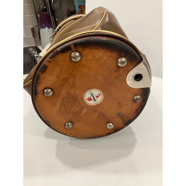 This golf bag style wastebasket is made of leather There is a liner of painted metal Genuine cowhide leather is stamped on...