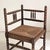Corner chair, known as a "spool" chair, in turned wood, Art Deco style, circa 1940 This low chair, sometimes called a...
