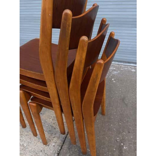 Set of Danish, teak and birch stacking chairs. Very solid somewhat like Chairs designed by Peter Hvidt. This model is...