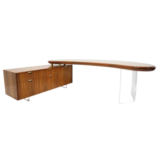 This is truly an exceptional desk designed and manufactured by Vladimir Kagan. The desk features a kidney shaped work area...