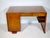 Art Deco walnut desk, 1920s. A simple, minimalist design with softly rounded edges and a striking walnut grain. Features...