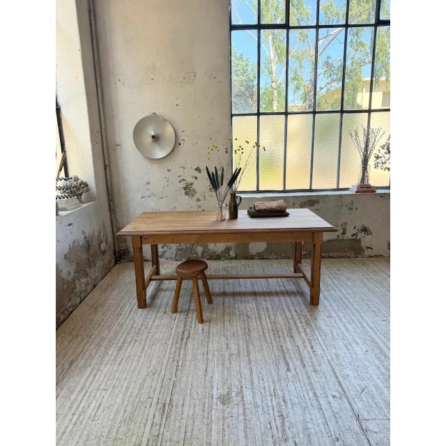 Solid pine farmhouse table with square, fluted legs and braces. we love its 190 x 90 cm size, which allows for a beautiful...