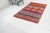 This is a vintage Turkish Oushak rug from the Mid 20th Century. The piece was hand-knotted.