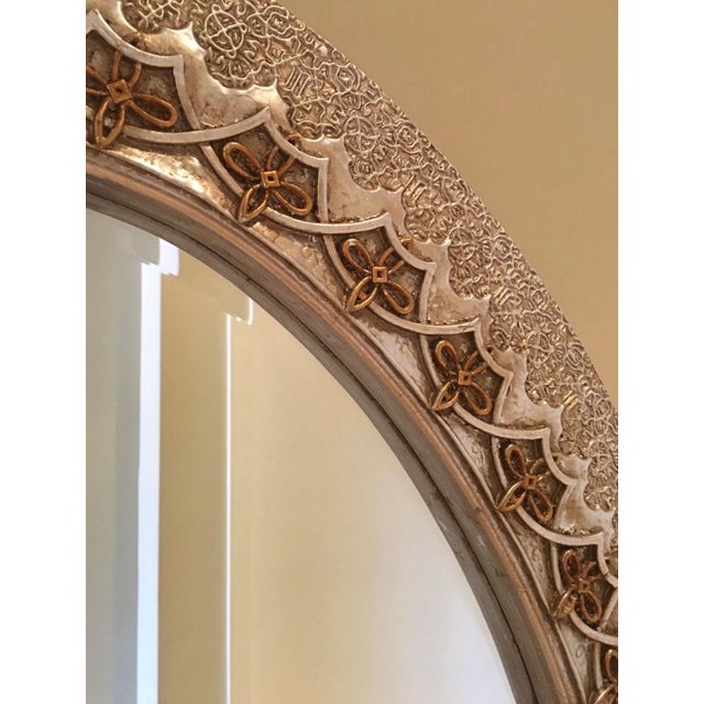 This Riviera style mirror by Mirror EFX has a hand carved wood frame with silver and gold leaf finish, Midas Silver. The...