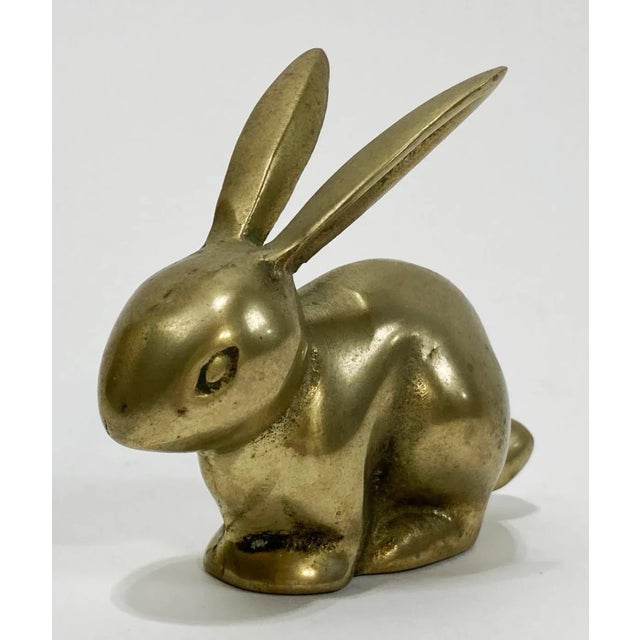 Vintage brass bunny seated with ears perked. Would make a great paper weight or decorative accessory. Wonderful patina.