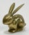 Vintage brass bunny seated with ears perked. Would make a great paper weight or decorative accessory. Wonderful patina.