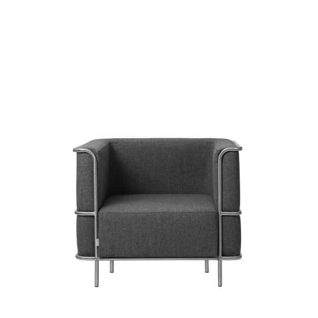 Grey modernist lounge chair by Kristina Dam Studio. Materials: Dark grey wool Dimensions: 87 x 77 x 70 cm Kristina Dam...
