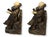 Early 20th century Pierrot figural bookends featuring the classic melancholy clown seated while playing a lute. These...