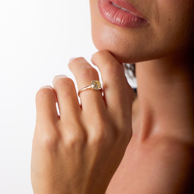 This captivating vintage solitaire engagement ring celebrates the soulful beauty of an Old Mine cut diamond paired with...