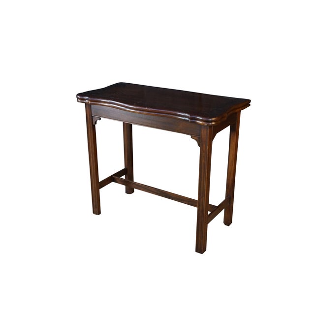 This handsome mid-century console table by Hekman Furniture of Grand Rapids, Michigan. Crafted from rich, dark-toned...