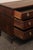 A French Louis XVI Provincial walnut commode, with beautiful hardware, from the early to mid 19th century. This antique...