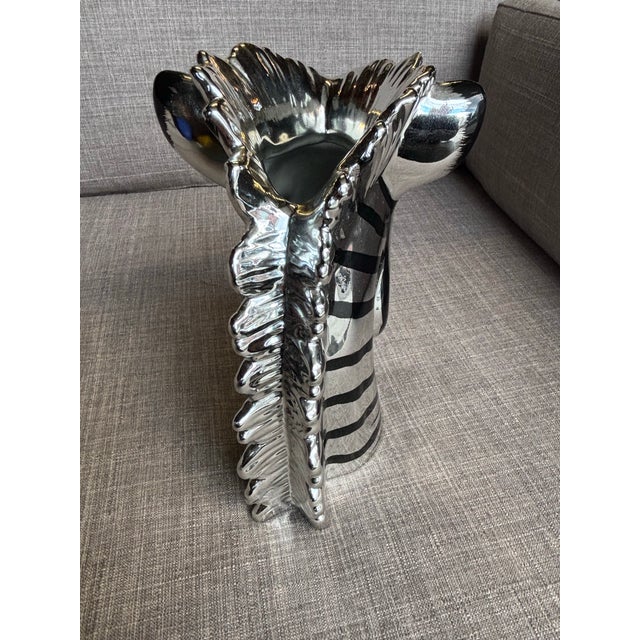 Fitz and Floyd Ceramic Silver and black Zebra. labels to underside. One small chip to top edge as seen in photo. Odd...