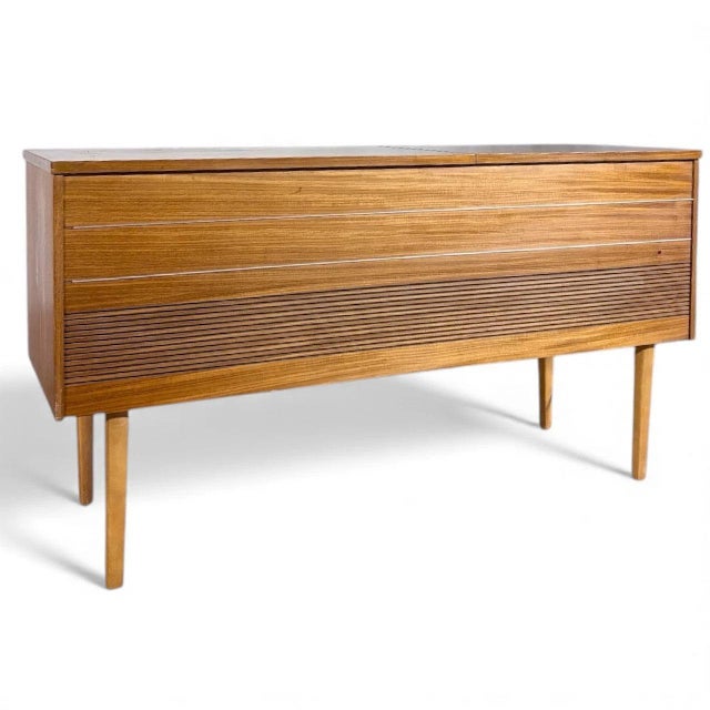 This vintage Bush radiogram is a beautifully preserved 1960s mid-century modern record player designed to bring warm,...