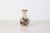 Vintage Mexican tonala pottery bud vase featuring a softly rounded form finished in warm earthenware tones with hand-...