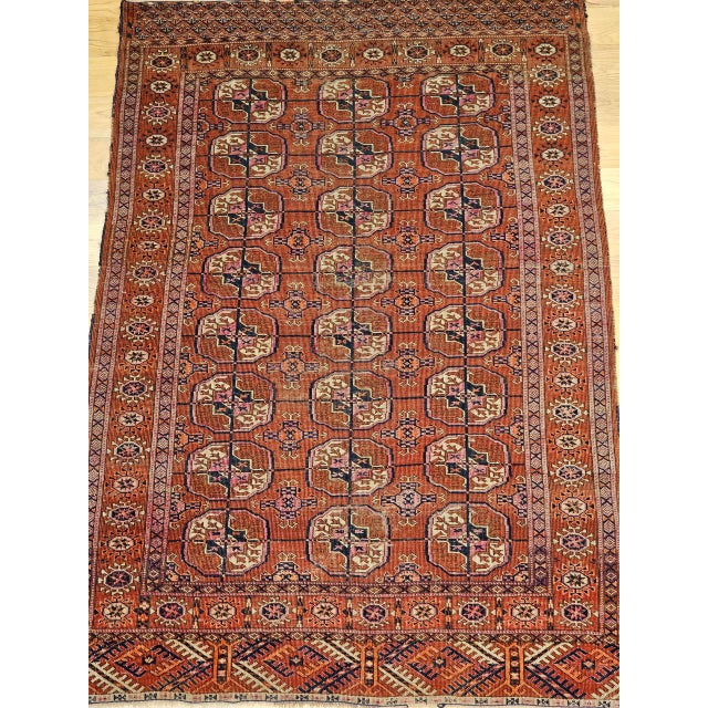 Beautiful early 20th century Turkmen Tekke area rug in an all over geometric pattern. This captivating rug features a...