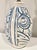 This vintage ceramic lamp features a distinctive incised, hand-painted blue pattern which straddles the line between...