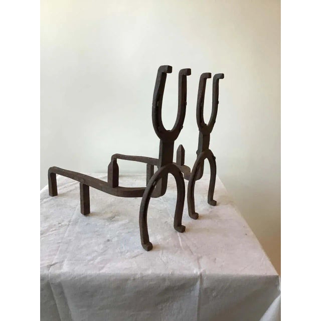 1950s iron horseshoe andirons.