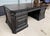 The Hooker Furniture Telluride Executive Desk makes an impressive statement with its black finish over cherry veneers,...