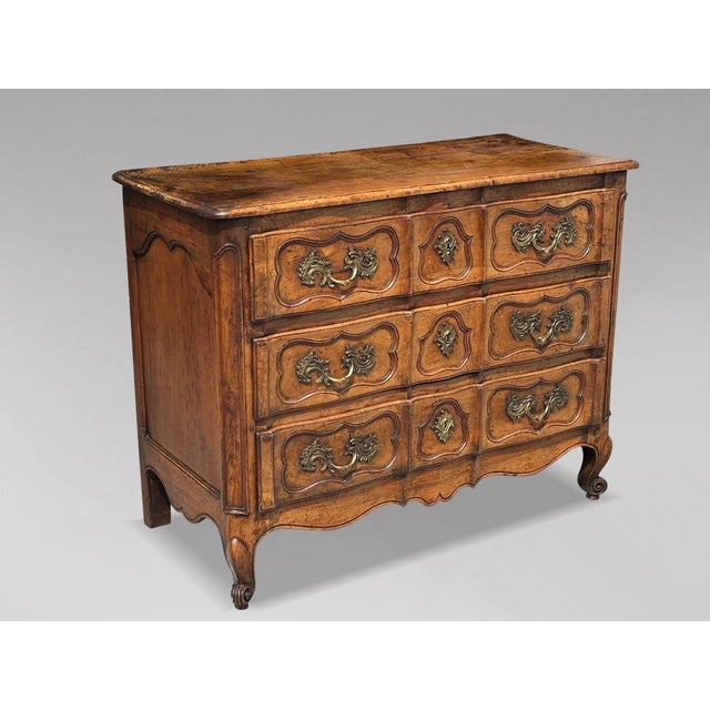 Charming 18th Century Louis XV Period Walnut Crossbow Commode This mid-18th-century walnut French provincial commode from...