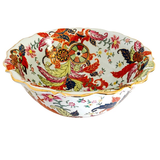 Bring vibrant 18th-century Chinoiserie elegance to your home with this magnificent vintage Tobacco Leaf porcelain bowl....