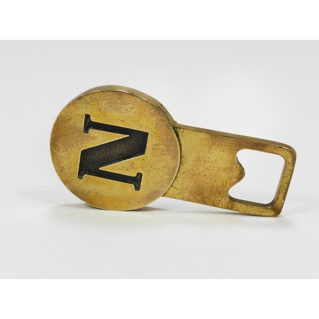 One (1) beautiful mid-century bottle opener featuring the initial "N", crafted from solid, polished brass. Model #4919,...
