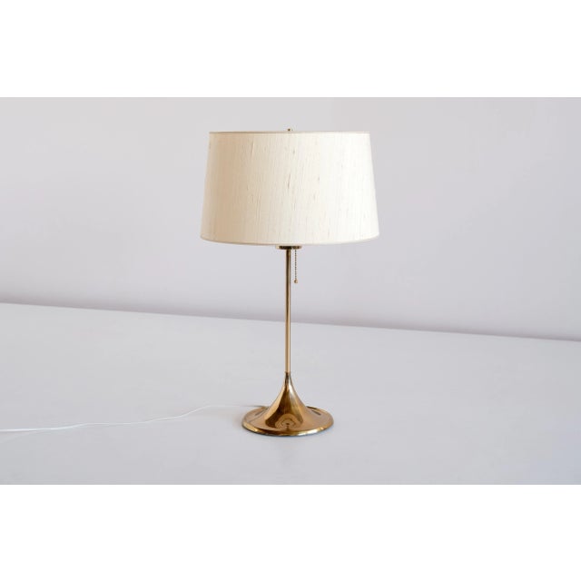 This elegant table lamp was produced by Bergboms in Sweden in the 1960s. The model is numbered B-024. The lamp consists of...