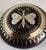 A charming late victorian brooch dating to circa 1880, finely decorated with gold and silver piqué work depicting a...