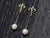 The Lighthouse Point: Ladies Fleur De Lis Pearl Dangler Earrings. The earrings feature elegant Fleur De Lis tops with a...