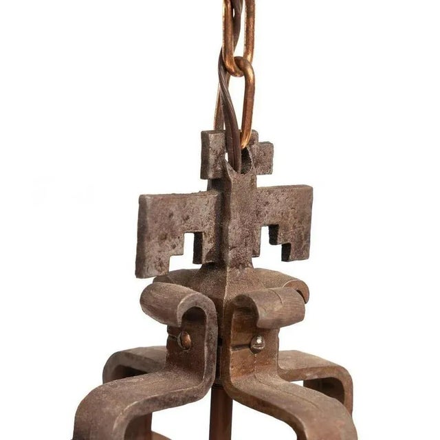 An extremely rare, vintage four light candle style hanging lamp chandelier by W.R. Dallas. Having elements of Western...