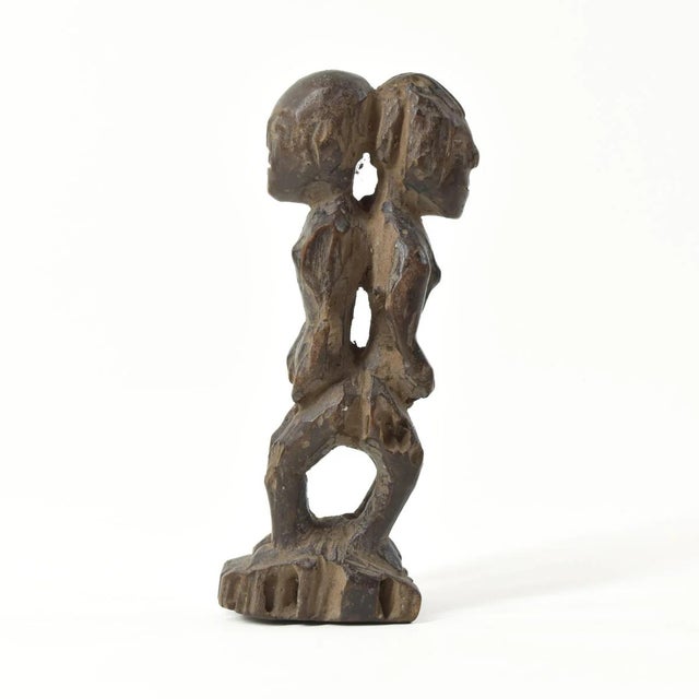 The Luba female and male figure is carved from one piece of wood.Â The history of the Luba people can be traced back 500...
