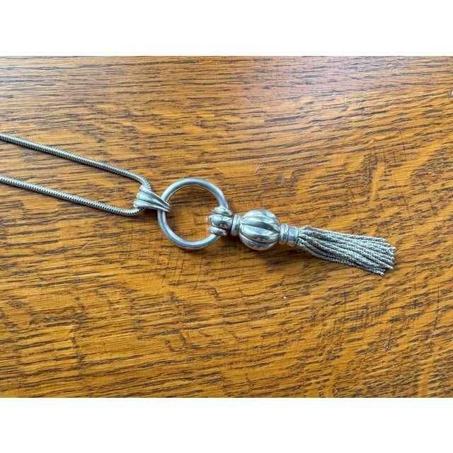 Tiffany & Co. rare tassel sterling silver necklace. Snake chain with lobster clasp closure.. Marks are on the pendant and...