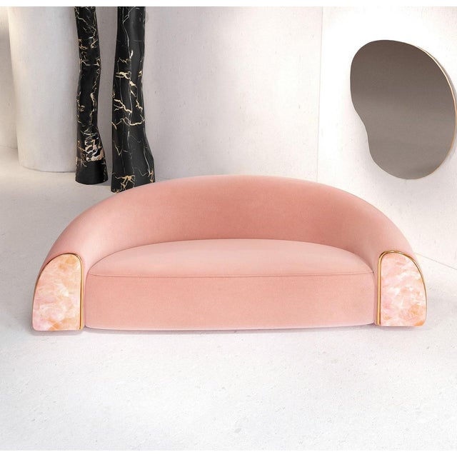 The universal shape of the sofa is complemented by the beauty of natural stone and the shine of polished metal.