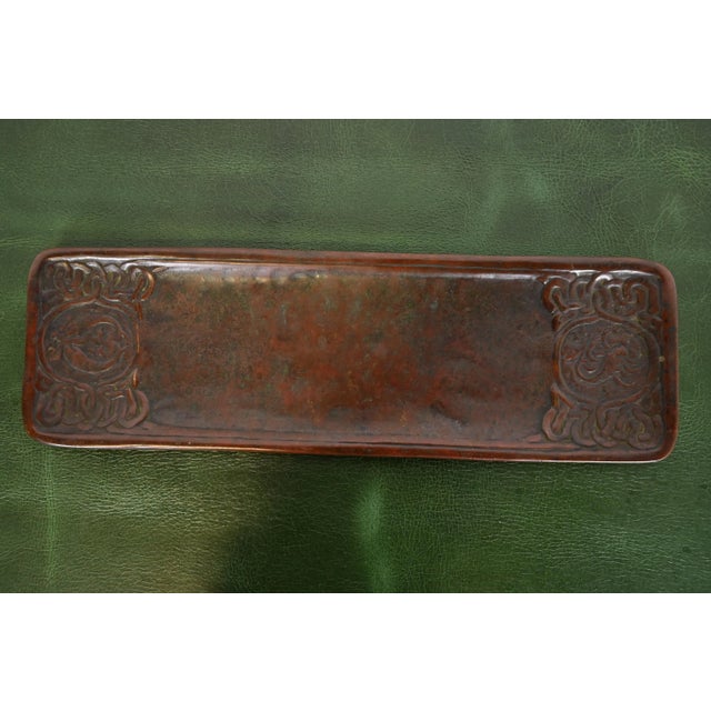 A gorgeous antique Arts & Crafts or Art Deco period bronze Zodiac pattern pen tray By Tiffany Studios (signed to the...