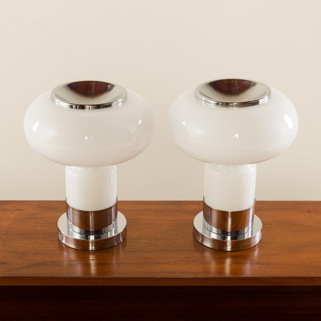 This set of two Murano glass table lamps was made during the 1970s in Italy. It is a very resemble to Guzzini lamps from...