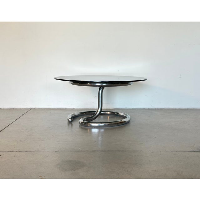 1960s Anaconda coffee table designed by Paul Tuttle for the Swiss company Strässle, made of chromed steel and with a...