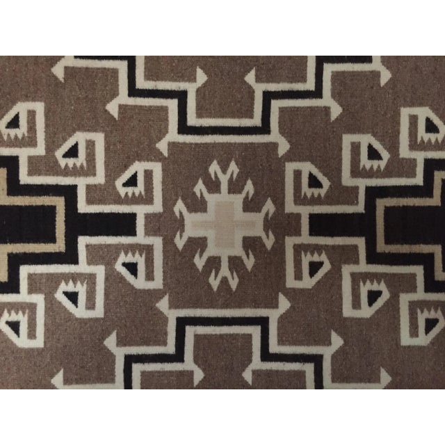Offered is a fine American Indian weaving, an exquisite example of a great geometric Navajo rug. The condition is...