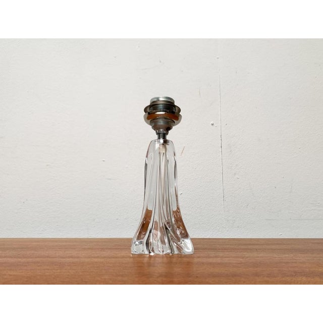 Mid-Century glass lamp by the French manufacturer Daum. The organically shaped glass feet of this manufacturer are...