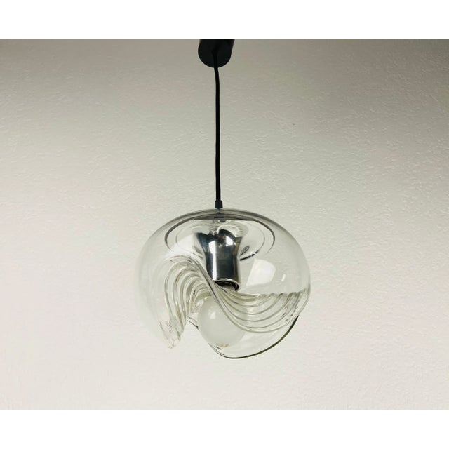 A round pendant lamp by Koch & Lowy for Peill and Putzler made in Germany in the 1960s. It is fascinating with its...