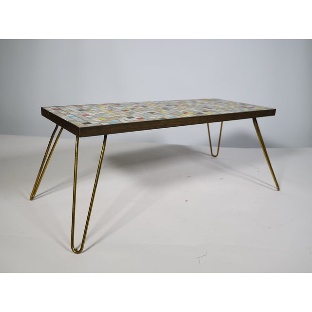 Vintage mosaic plant stand from the 1950s/1960s with original hairpin legs and brass-colored trim. Rectangular mosaic top...