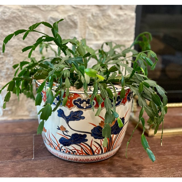 Add a touch of timeless elegance to your home with this striking antique Japanese Imari style porcelain jardiniere....